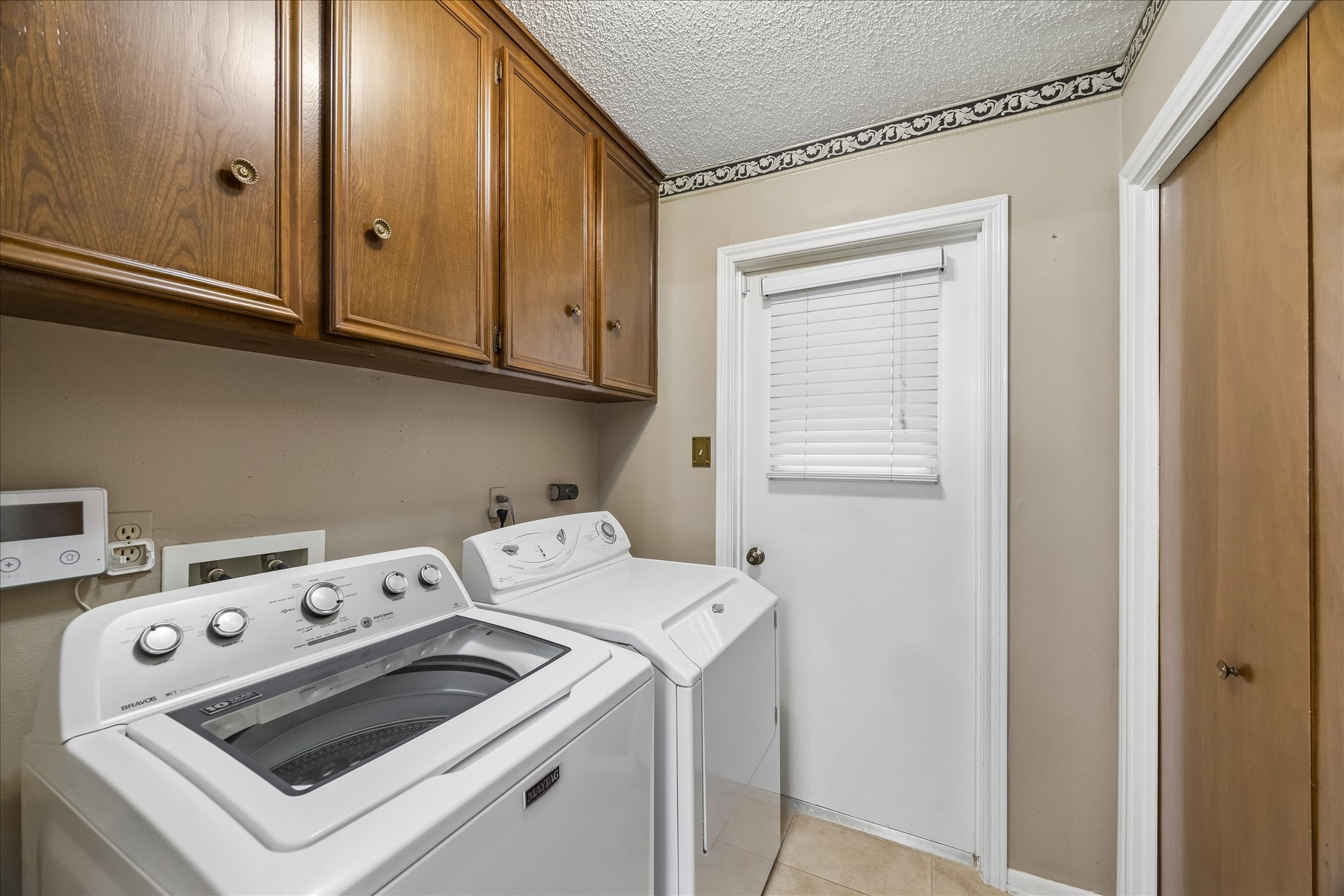 322 Enchanted River Drive Spring, TX 77388 - Photo 27 of 28 a utility room with dryer and washer