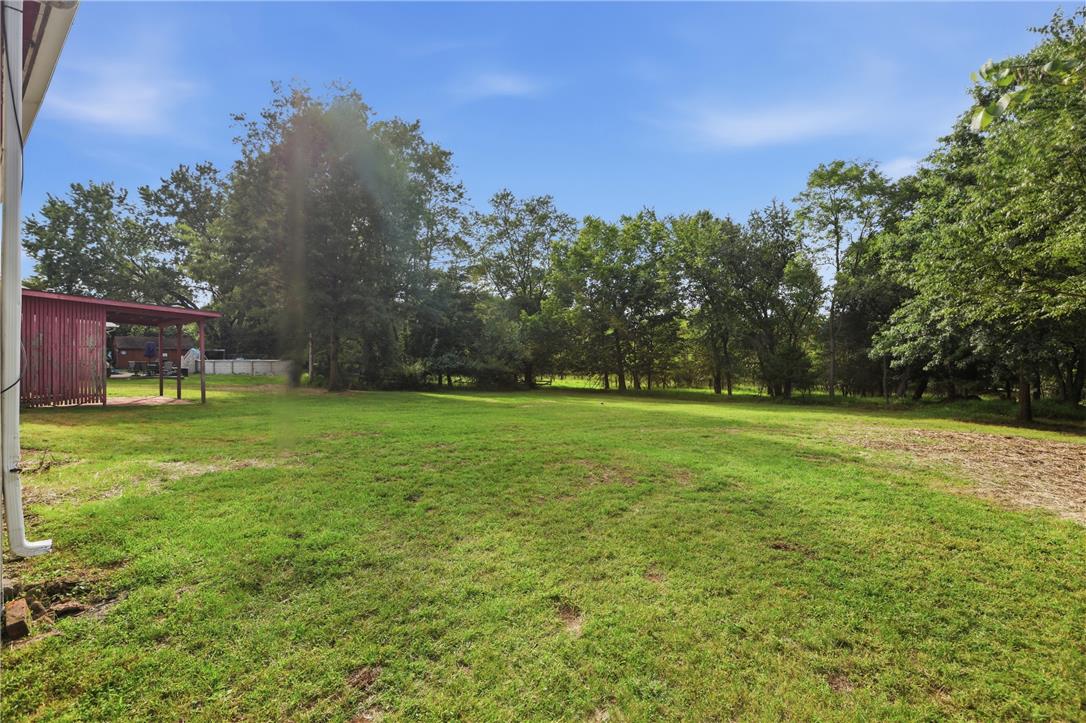 1033 Walt Road Pennsburg, PA 18073 - Photo 35 of 40 Mature trees frame a grassy lawn offering abundant space for outdoor activities.