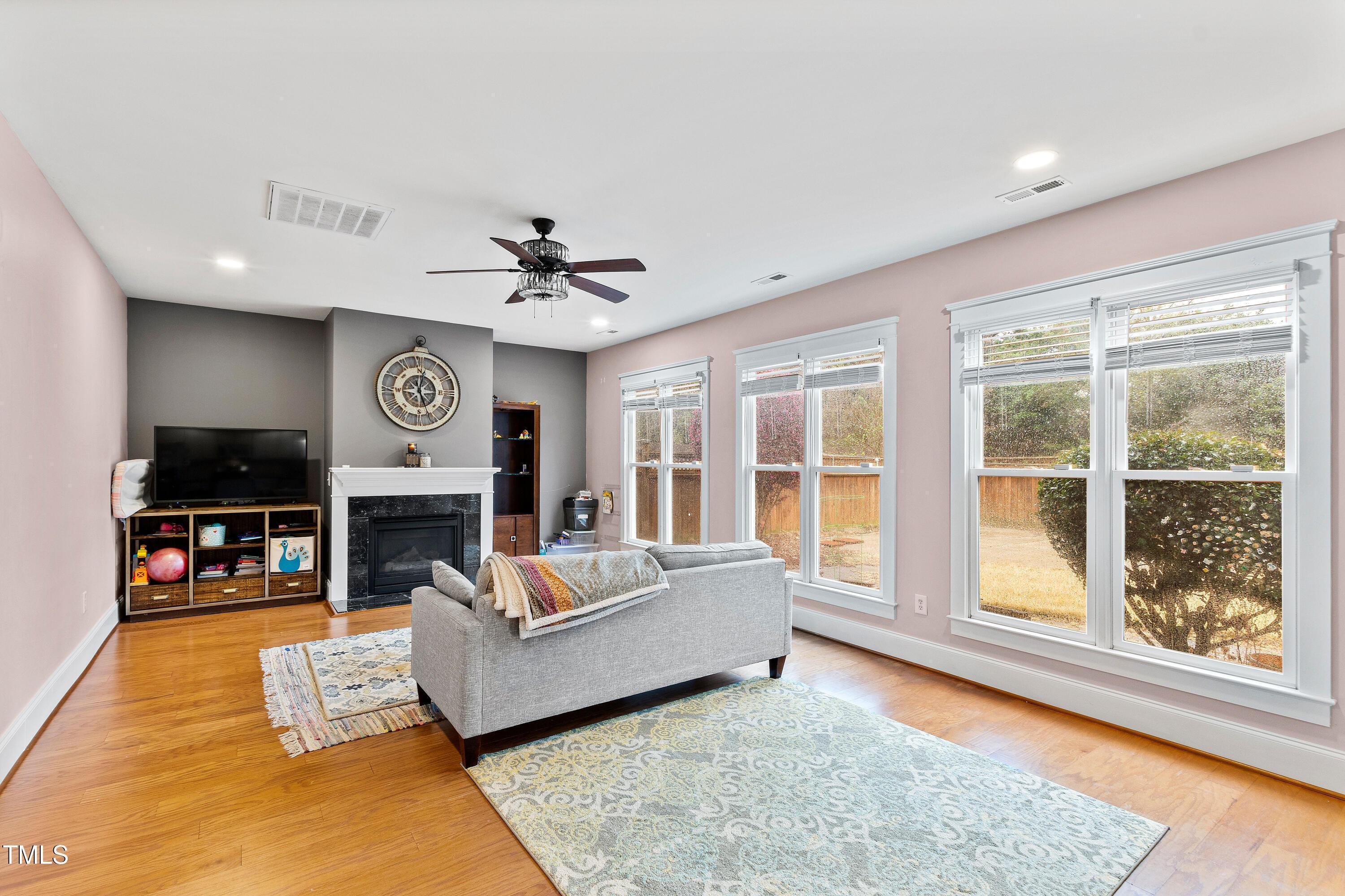 204 Frontgate Drive Cary, NC 27519 - Photo 18 of 41 a living room with furniture and a fireplace