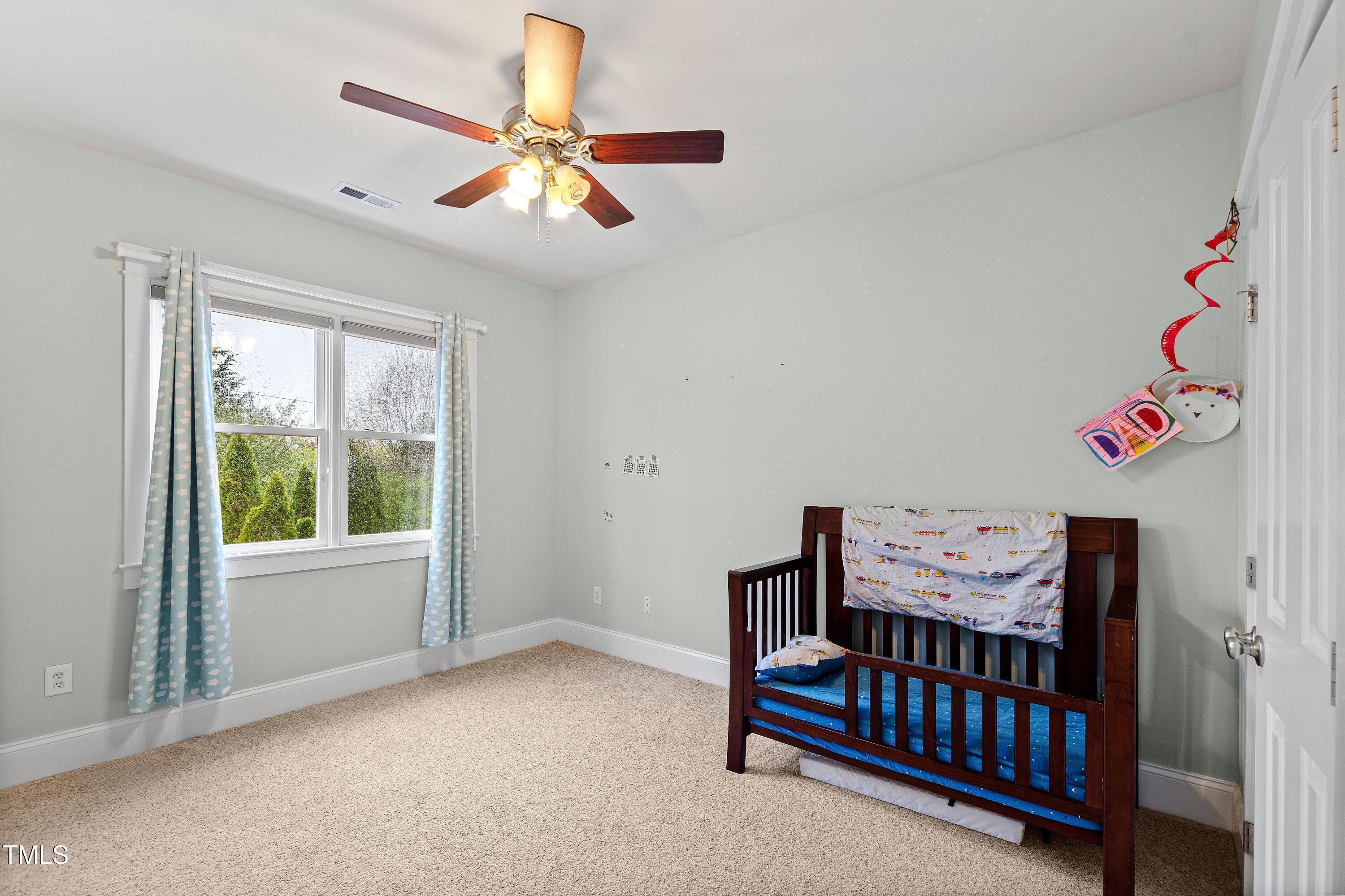 204 Frontgate Drive Cary, NC 27519 - Photo 30 of 41 a bedroom with furniture and a window