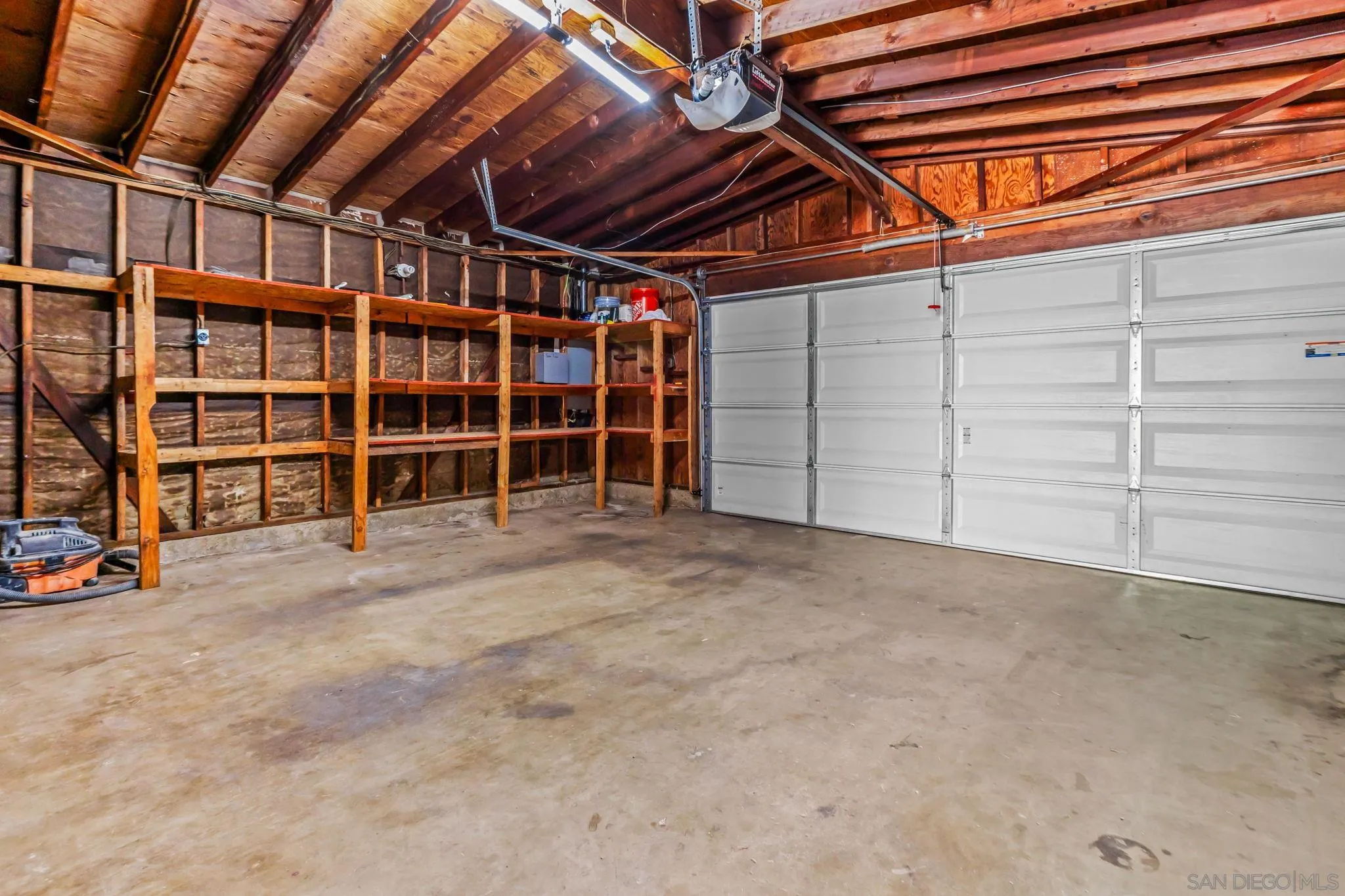 13323 Frame Road Poway, CA 92064 - Photo 20 of 30 a view of an empty room with wooden shelves