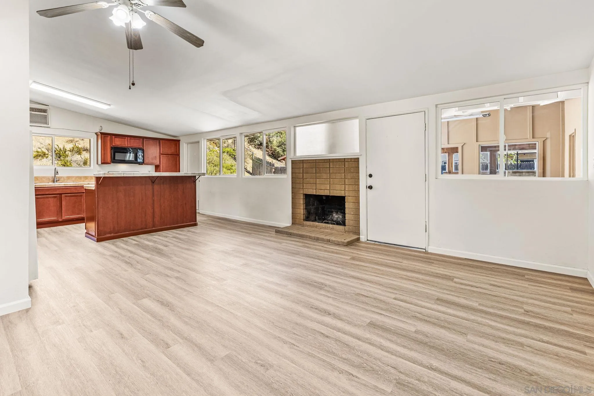 13323 Frame Road Poway, CA 92064 - Photo 5 of 30 a view of livingroom with furniture wooden floor and window