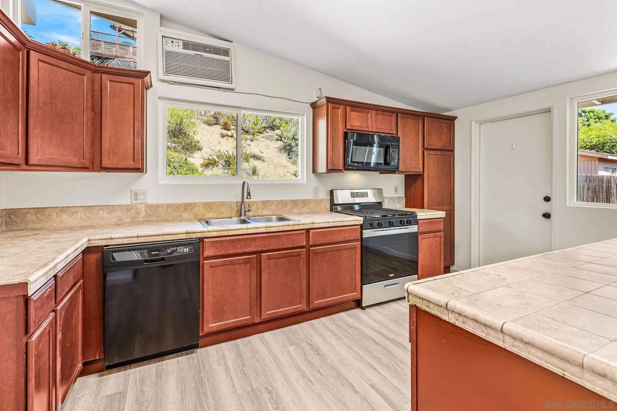 13323 Frame Road Poway, CA 92064 - Photo 8 of 30 a kitchen with a sink stove and cabinets
