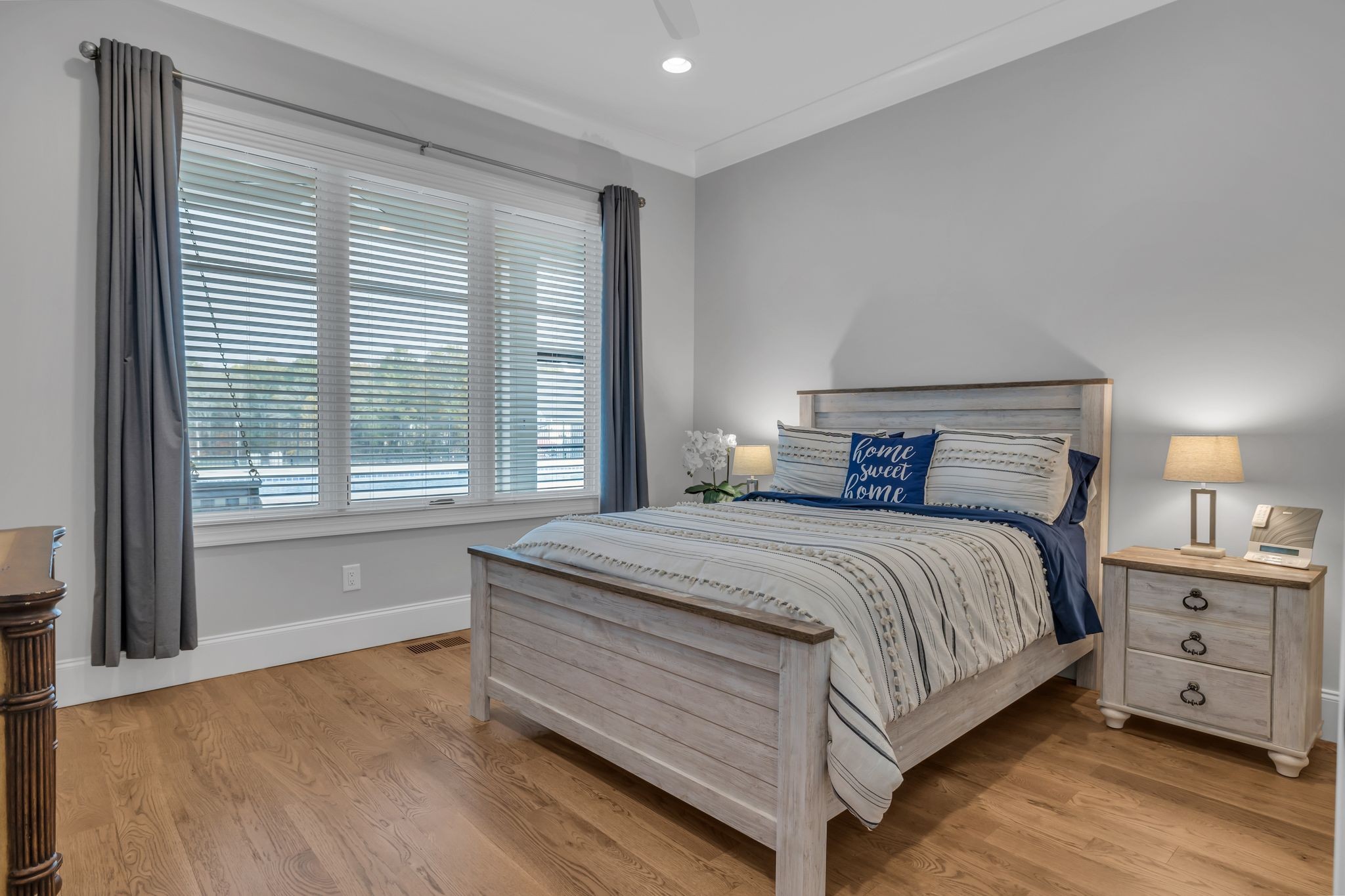 2836 Buford Lane Spring Hill, TN 37174 - Photo 19 of 41 a bedroom with a large bed and a large window