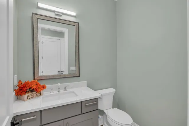 a view of a livingroom with furniture and a window