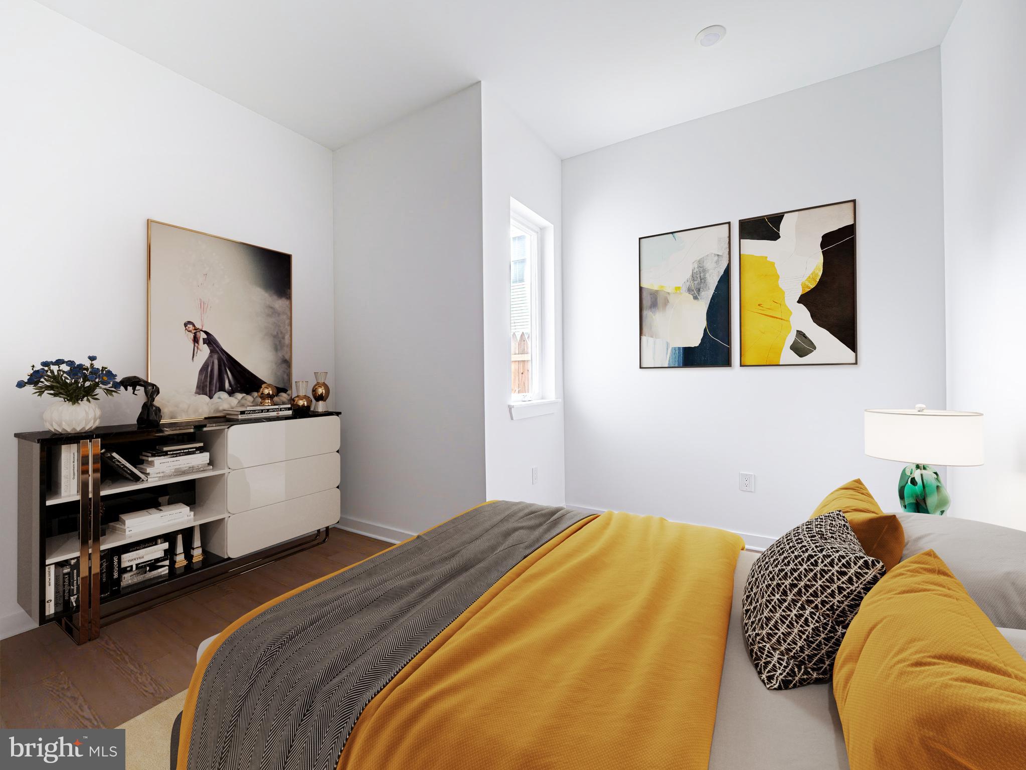 a bedroom with a bed and painting on the wall