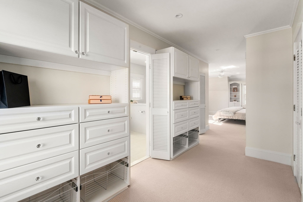 40 Hillcrest Road Belmont, MA 02478 - Photo 20 of 39 a view of a kitchen with white cabinets and a ceiling fan