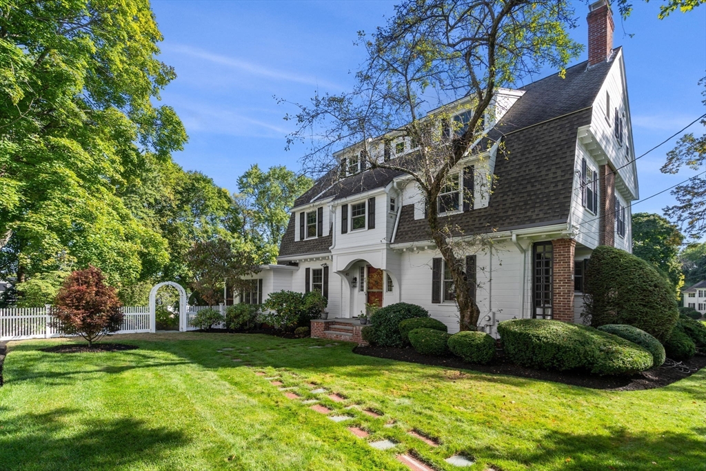 40 Hillcrest Road Belmont, MA 02478 - Photo 32 of 39 a view of a white house next to a yard with big trees