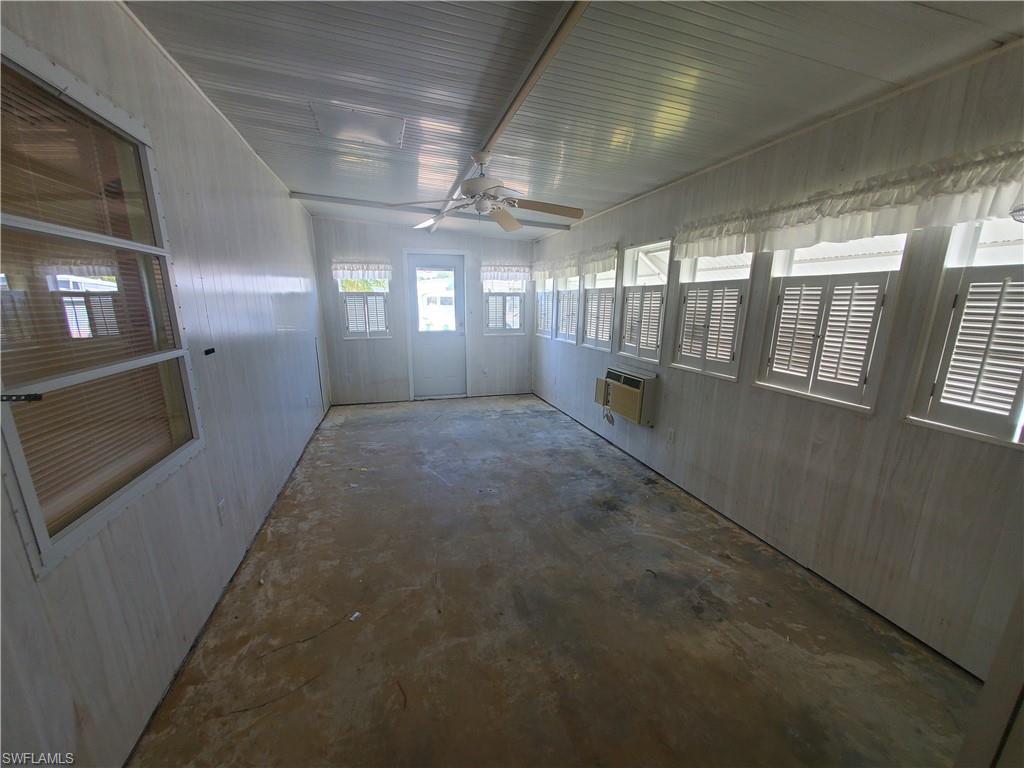 40 Enchanting Boulevard, Unit E40 Naples, FL 34112 - Photo 3 of 9 a hallway with windows