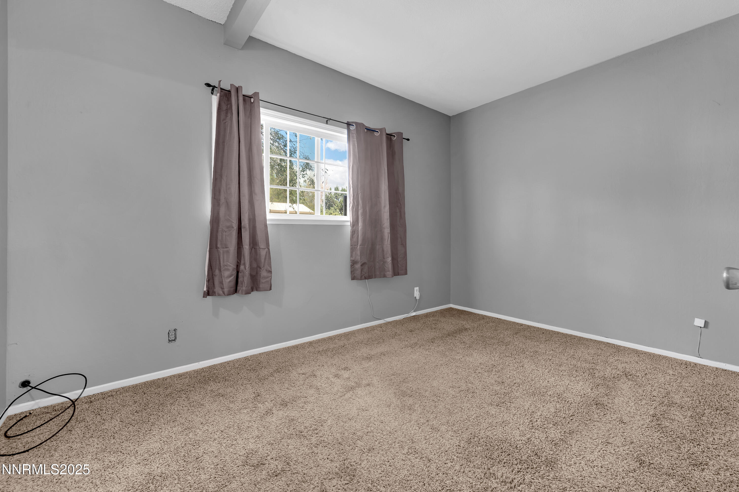 5760 Leon Drive Sun Valley, NV 89433 - Photo 15 of 42 an empty room with windows