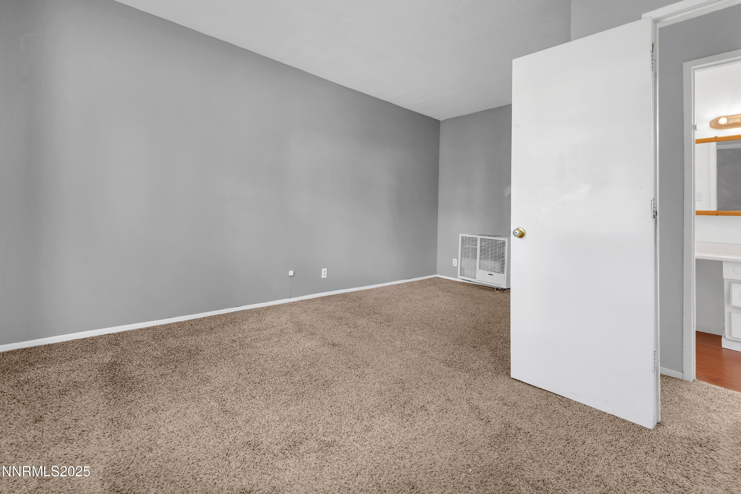 5760 Leon Drive Sun Valley, NV 89433 - Photo 16 of 42 an empty room with a natural light