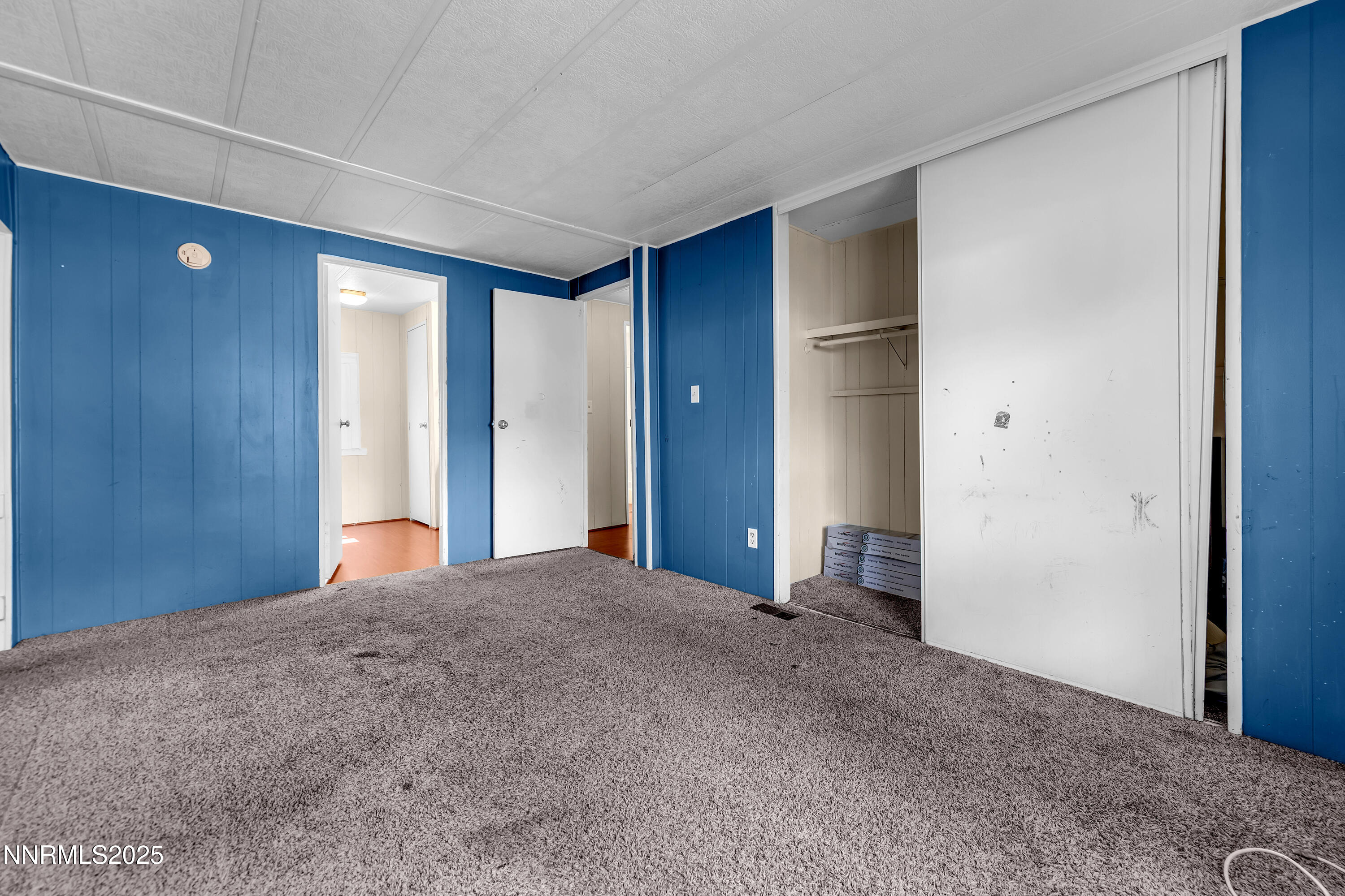 5760 Leon Drive Sun Valley, NV 89433 - Photo 22 of 42 a view of empty room with closet and entryway