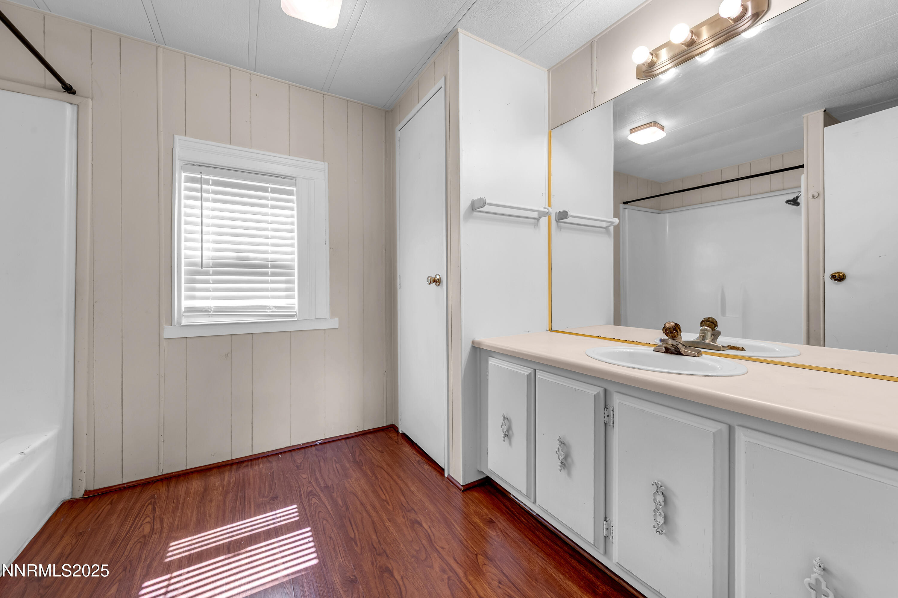 5760 Leon Drive Sun Valley, NV 89433 - Photo 23 of 42 a bathroom with a sink and a mirror
