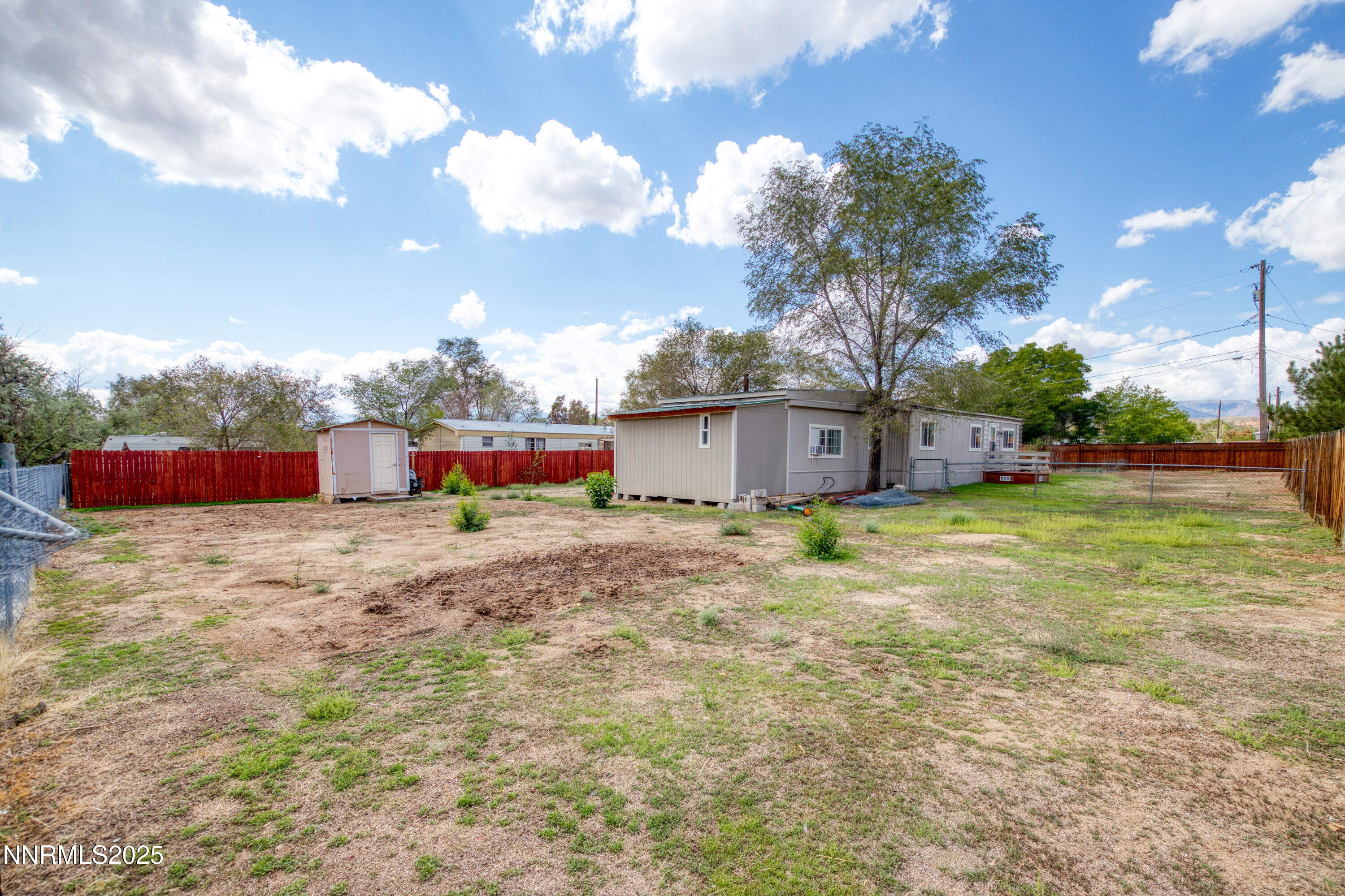 5760 Leon Drive Sun Valley, NV 89433 - Photo 34 of 42 a fire hydrant in the middle of a field