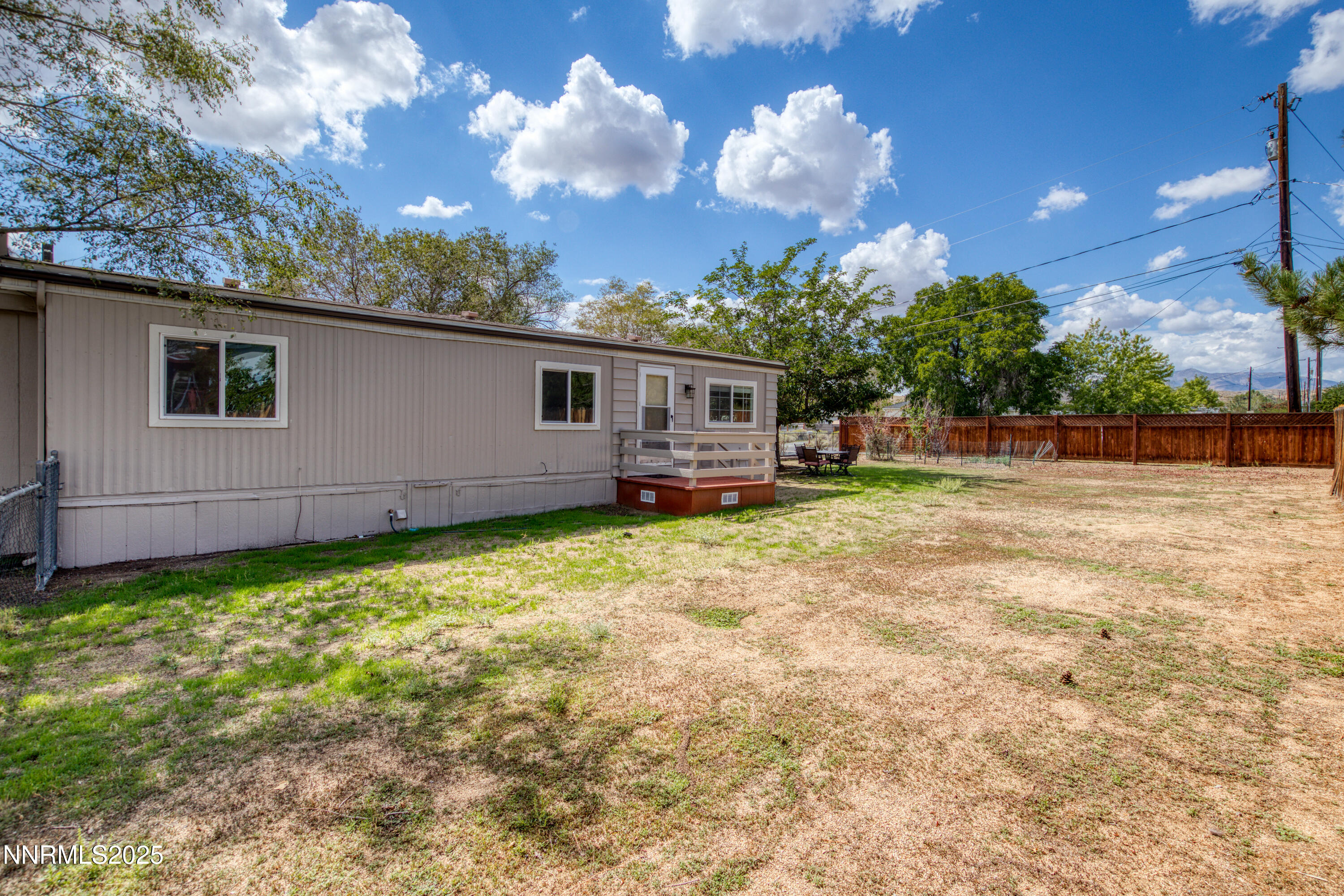5760 Leon Drive Sun Valley, NV 89433 - Photo 36 of 42 a backyard of a house with table and chairs