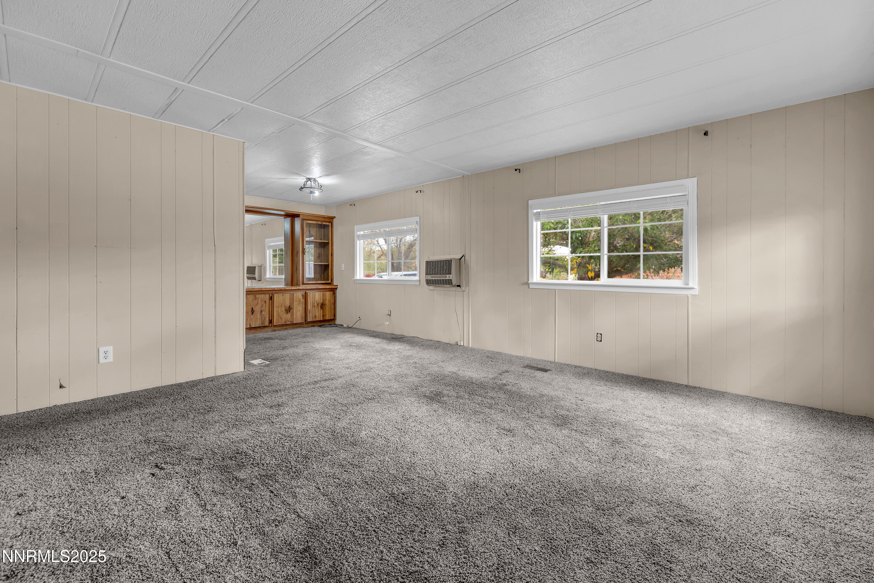 5760 Leon Drive Sun Valley, NV 89433 - Photo 5 of 42 an empty room with windows