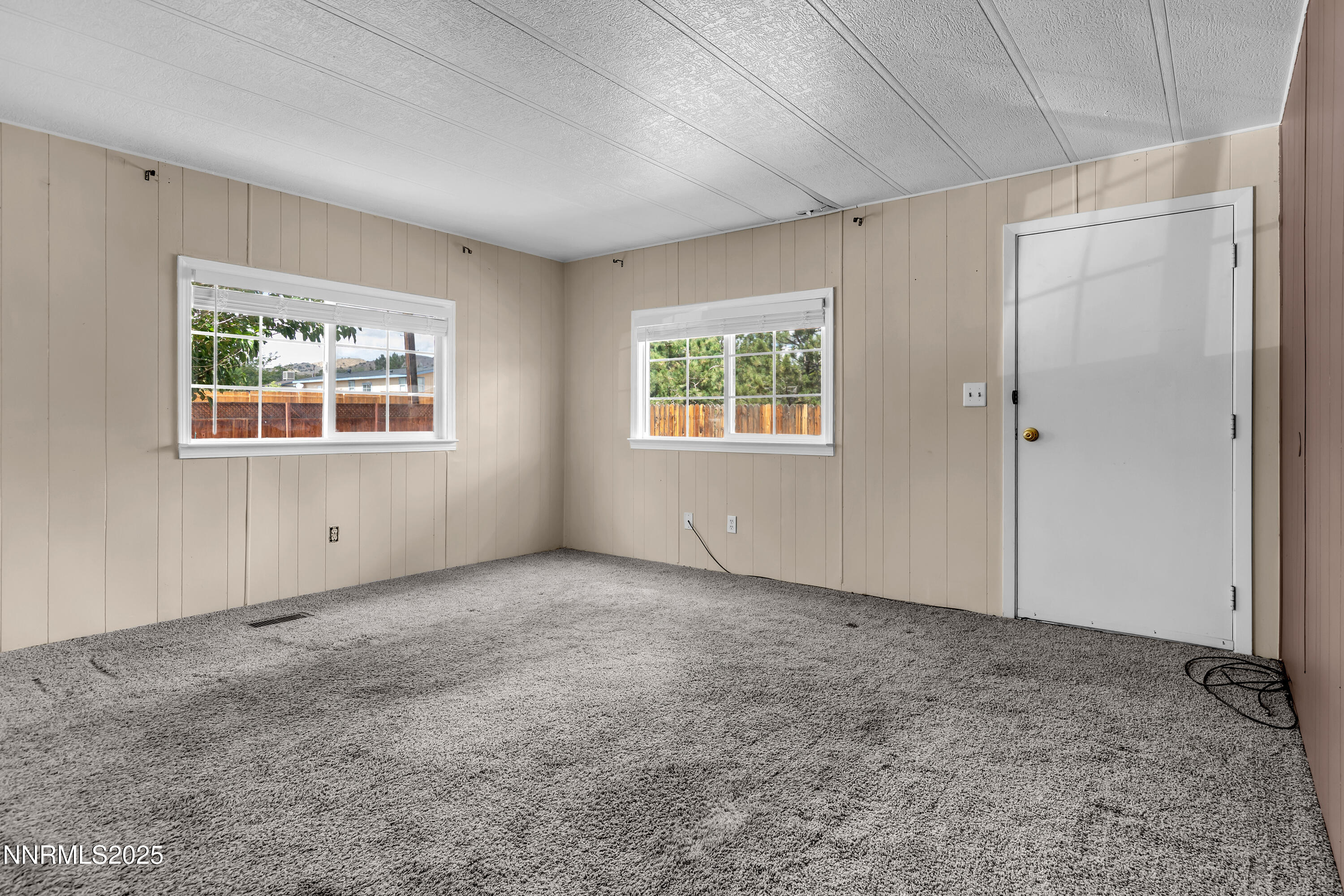 5760 Leon Drive Sun Valley, NV 89433 - Photo 8 of 42 an empty room with windows