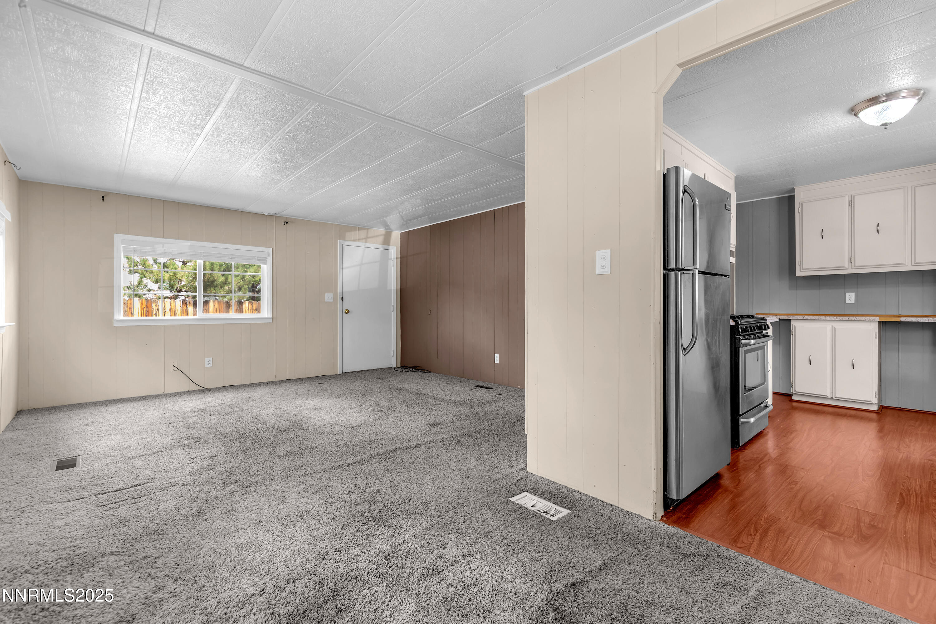 5760 Leon Drive Sun Valley, NV 89433 - Photo 10 of 42 a view of a kitchen with a sink and a refrigerator