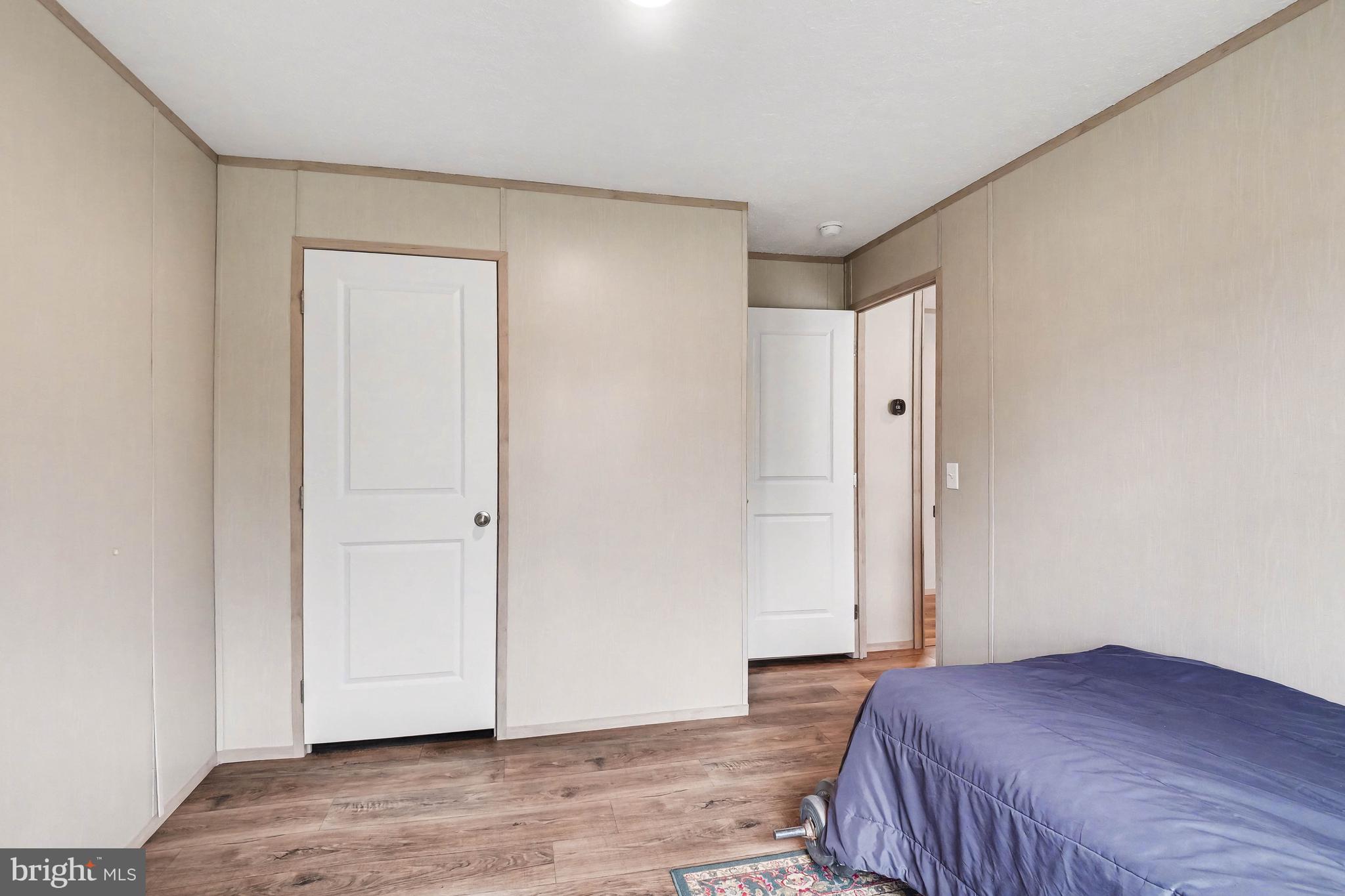 2096 Scull Street Lebanon, PA 17046 - Photo 13 of 28 a bedroom with a bed and wooden floor