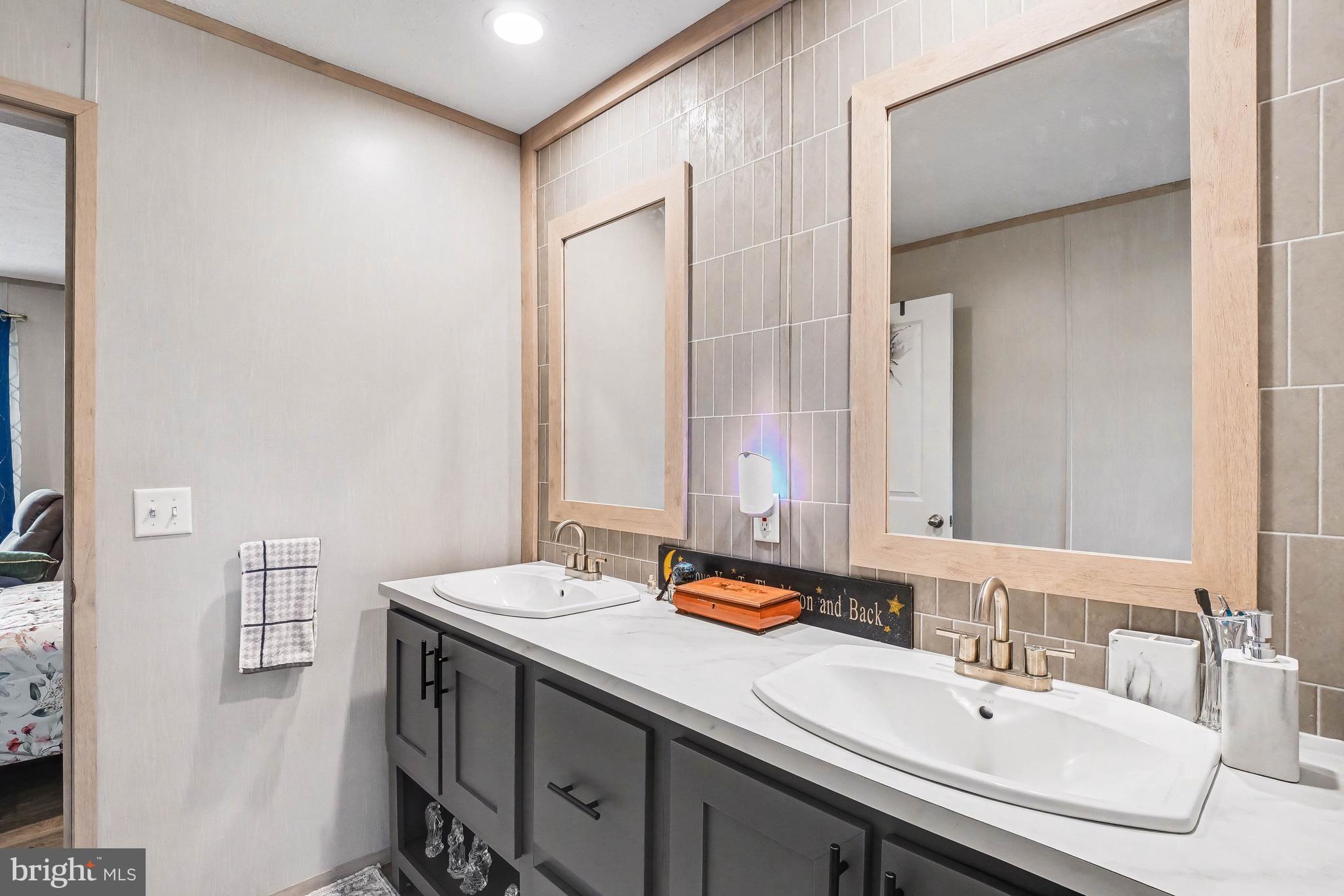 2096 Scull Street Lebanon, PA 17046 - Photo 23 of 28 a bathroom with a sink and a mirror