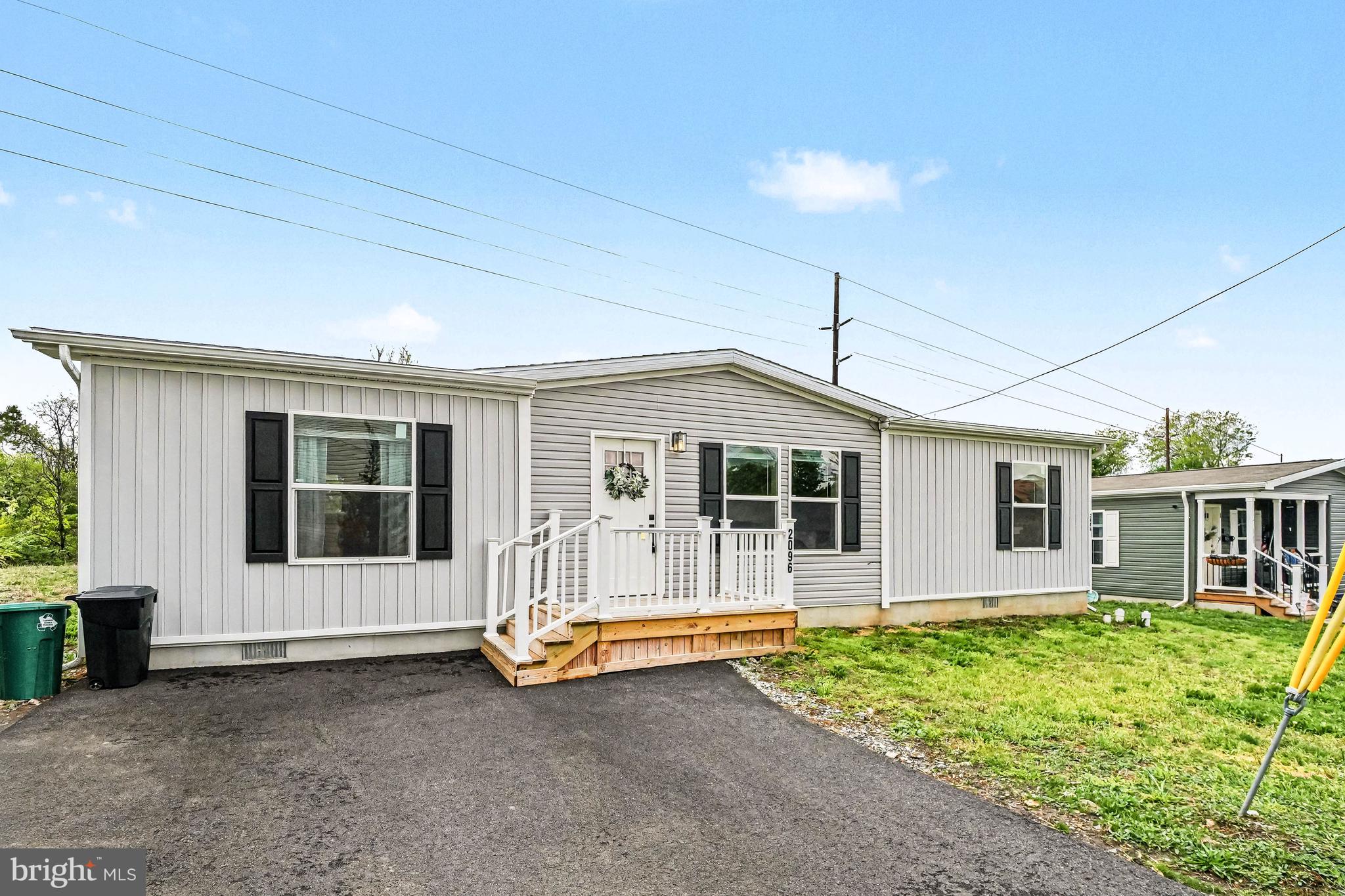 2096 Scull Street Lebanon, PA 17046 - Photo 3 of 28 a view of a house with large windows and a small yard