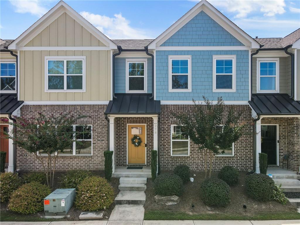a front view of a house with a yard