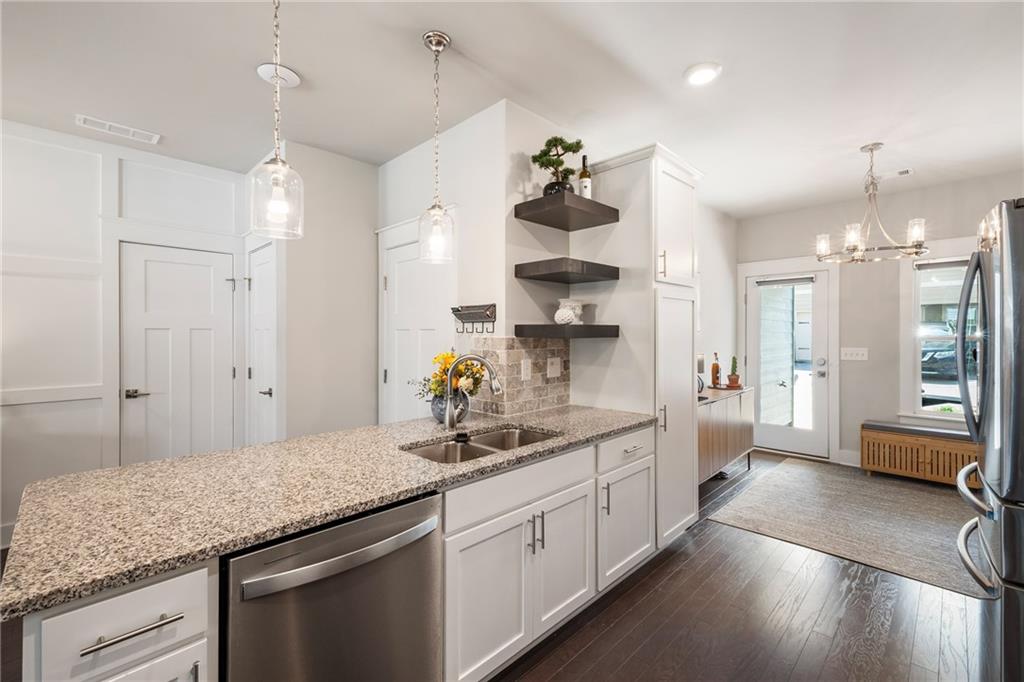 278 Perry Point Run, Unit 56 Lawrenceville, GA 30046 - Photo 11 of 36 a kitchen with sink cabinets and window