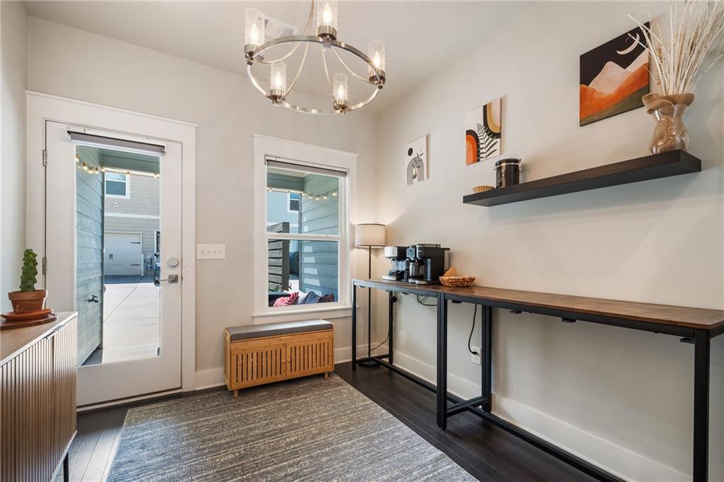 278 Perry Point Run, Unit 56 Lawrenceville, GA 30046 - Photo 13 of 36 a very nice looking room with many windows and furniture