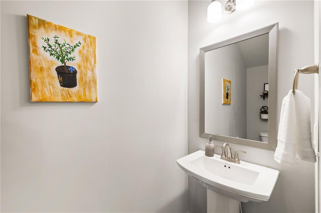 278 Perry Point Run, Unit 56 Lawrenceville, GA 30046 - Photo 14 of 36 a bathroom with a sink and mirror