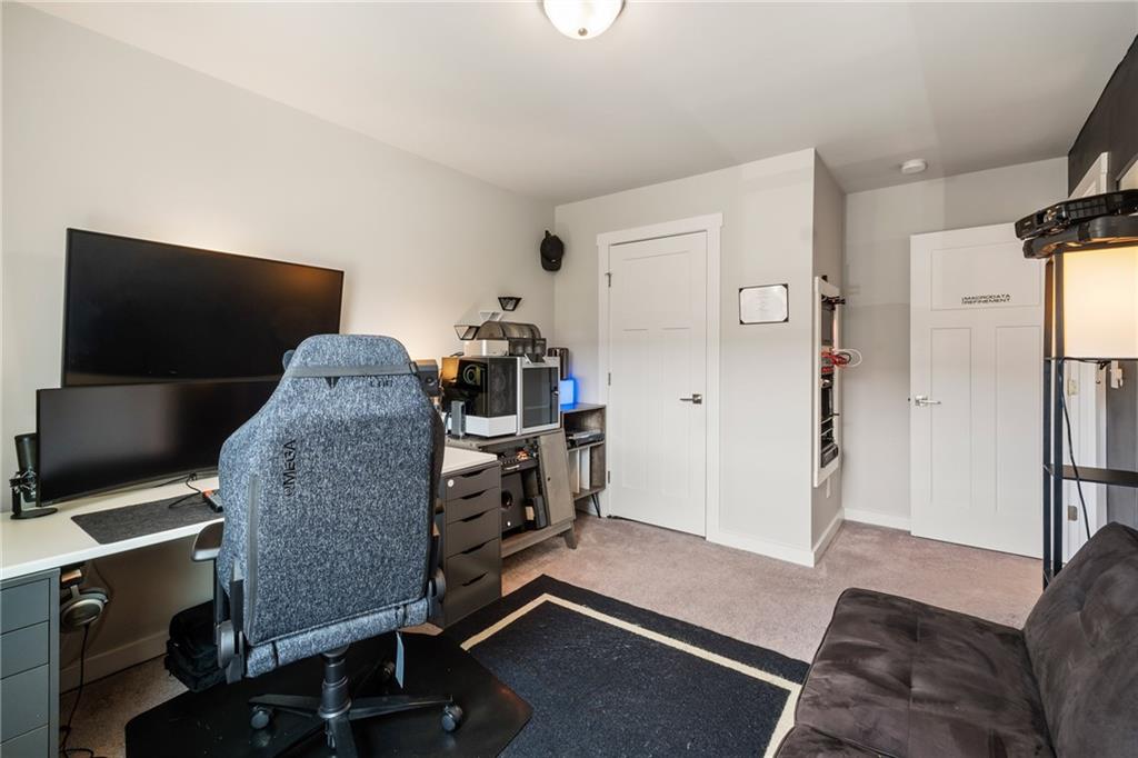 278 Perry Point Run, Unit 56 Lawrenceville, GA 30046 - Photo 23 of 36 a living room with furniture and a flat screen tv