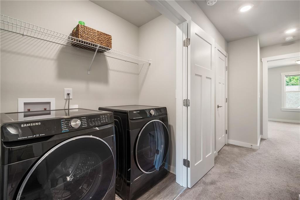 278 Perry Point Run, Unit 56 Lawrenceville, GA 30046 - Photo 27 of 36 a utility room with dryer and washer