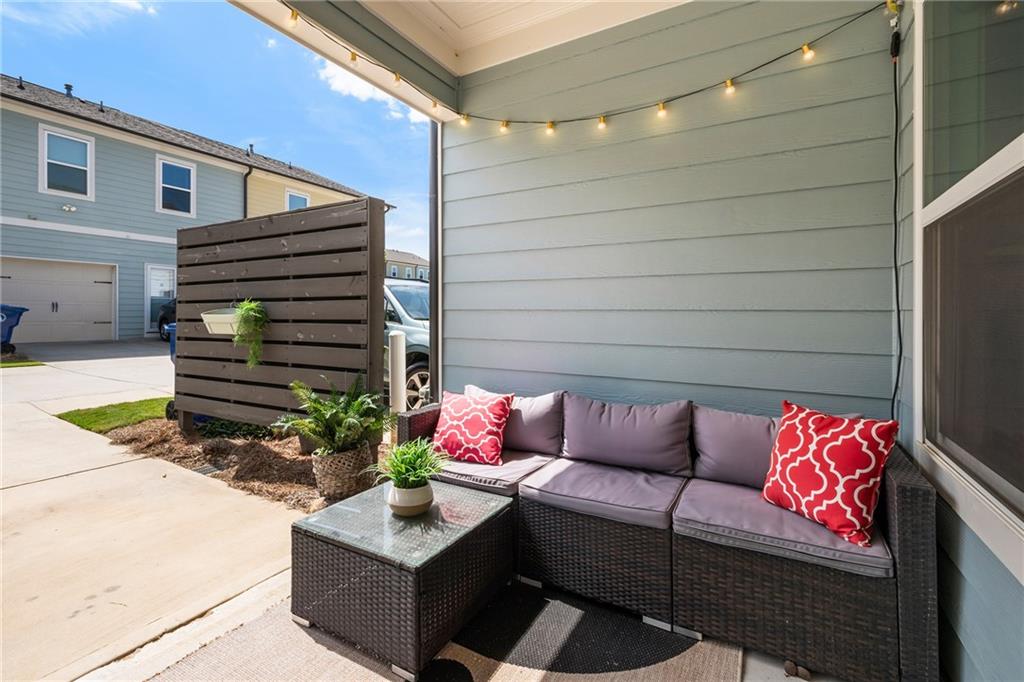 278 Perry Point Run, Unit 56 Lawrenceville, GA 30046 - Photo 28 of 36 a wooden bench sitting in front of a building