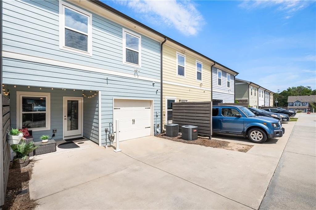 278 Perry Point Run, Unit 56 Lawrenceville, GA 30046 - Photo 30 of 36 a view of a car in front of a house