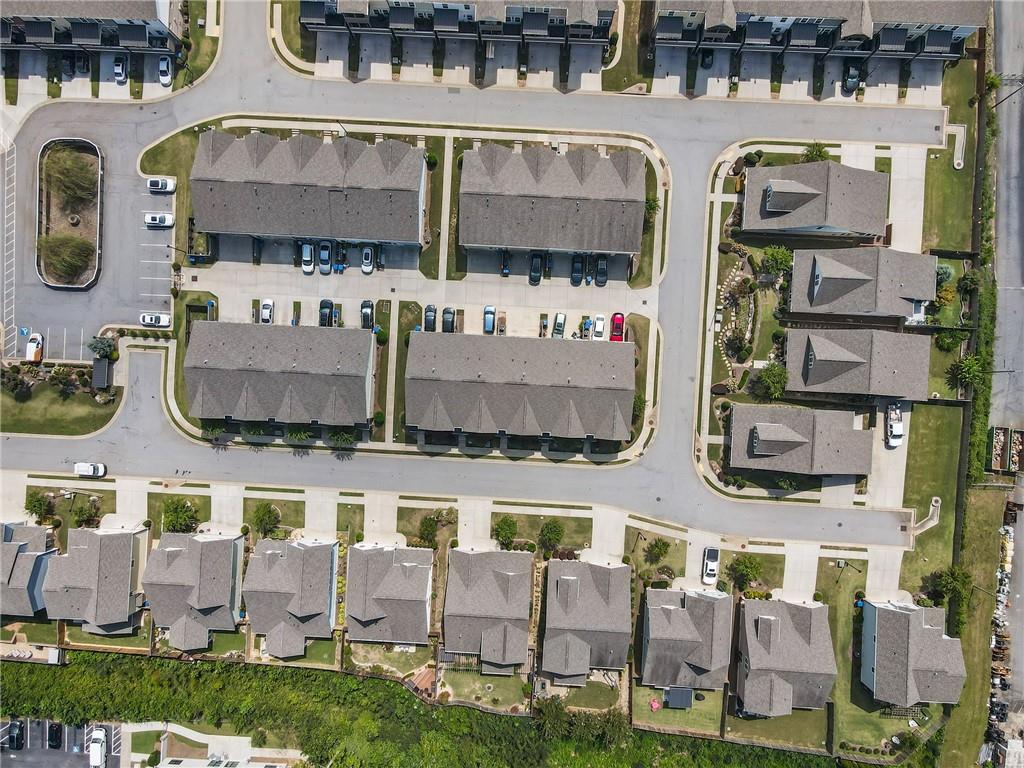 278 Perry Point Run, Unit 56 Lawrenceville, GA 30046 - Photo 32 of 36 a front view of a building with outdoor area and parking