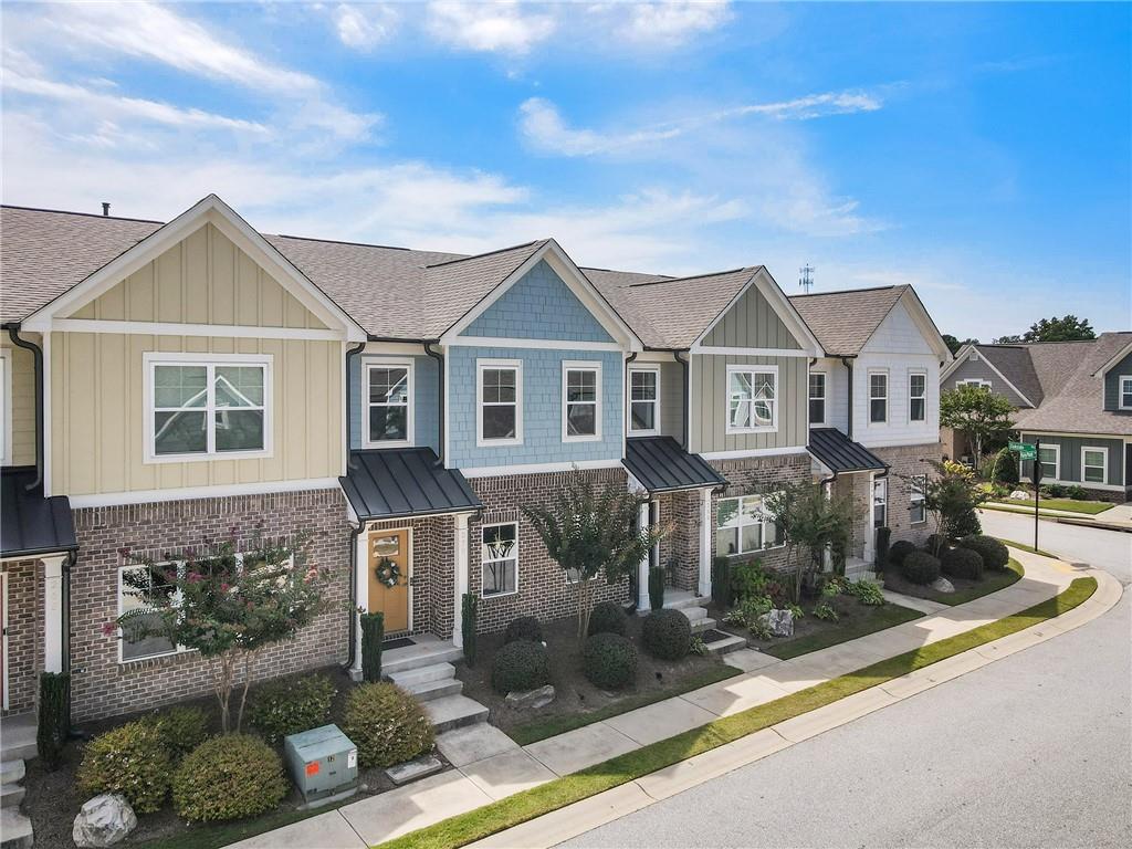 278 Perry Point Run, Unit 56 Lawrenceville, GA 30046 - Photo 35 of 36 a front view of a house with garden