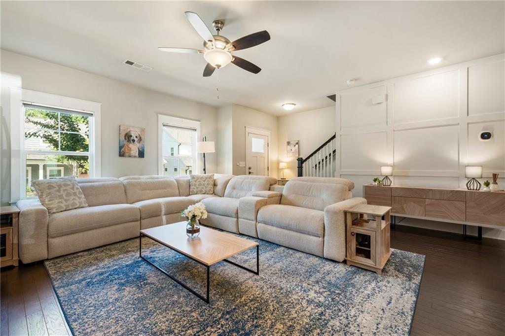 278 Perry Point Run, Unit 56 Lawrenceville, GA 30046 - Photo 9 of 36 a living room with furniture wooden floor and a table