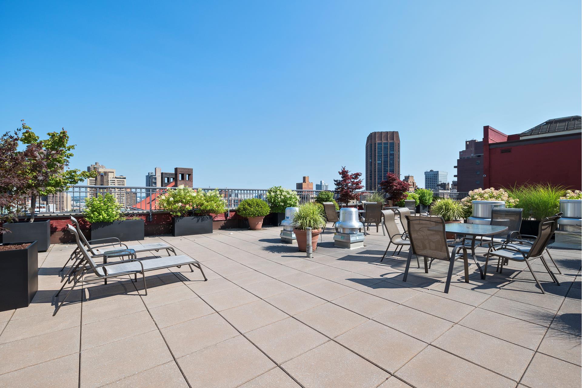 244 Madison Avenue, Unit 12F Manhattan, NY 10016 - Photo 10 of 11 a outdoor space with lots of tables and chairs