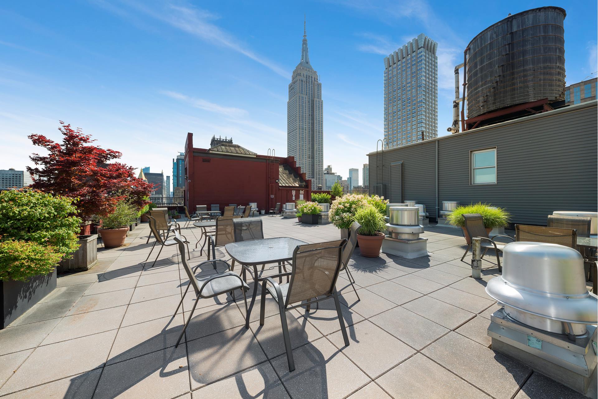 244 Madison Avenue, Unit 12F Manhattan, NY 10016 - Photo 8 of 11 a view of outdoor dining space with a table and chairs