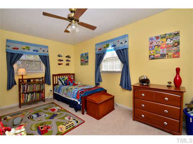 7309 Mine Valley Road Raleigh, NC 27615 - Photo 11 of 15 a bedroom with furniture and a window