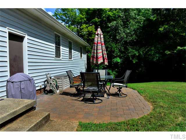 7309 Mine Valley Road Raleigh, NC 27615 - Photo 12 of 15 a view of a patio with a table and chairs