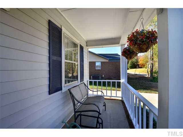 7309 Mine Valley Road Raleigh, NC 27615 - Photo 2 of 15 a view of a porch with furniture and garden
