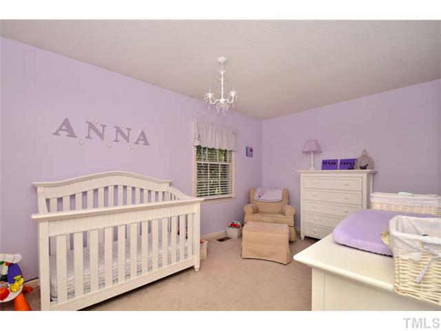7309 Mine Valley Road Raleigh, NC 27615 - Photo 10 of 15 a bedroom with furniture and a window