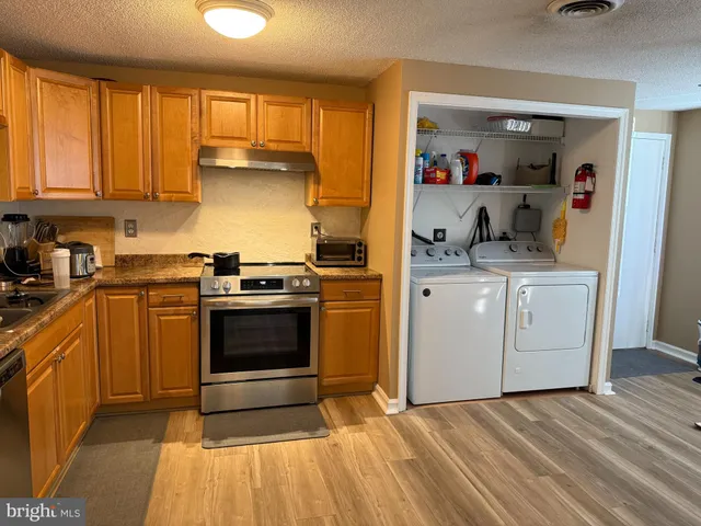 a kitchen with a stove and a sink