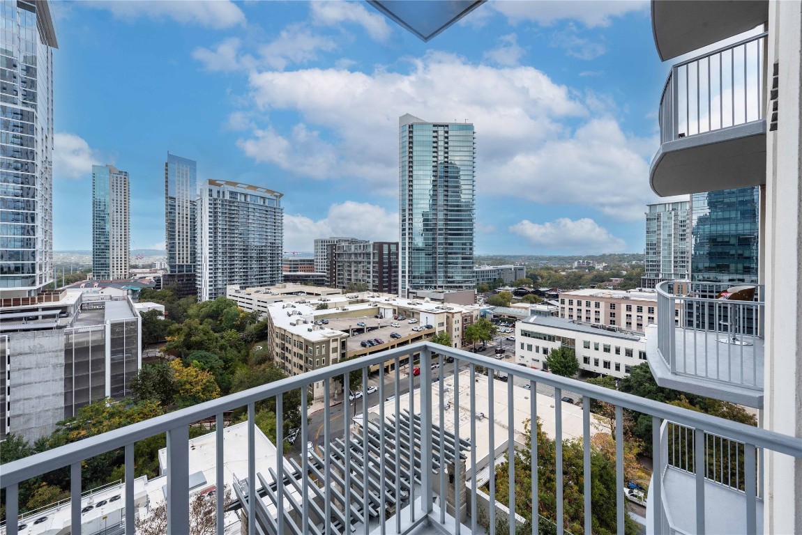 a view of a balcony with city view