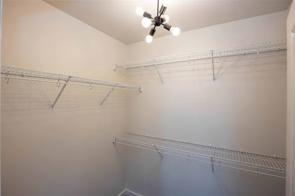 a view of a room with racks on the wall