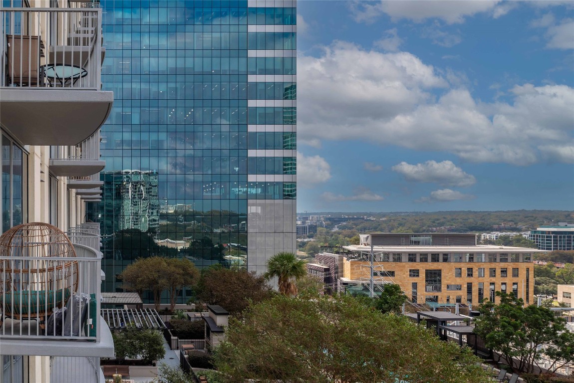 360 Nueces Street, Unit 1214 Austin, TX 78701 - Photo 24 of 38 a view of a patio with dining table and chairs and potted plants