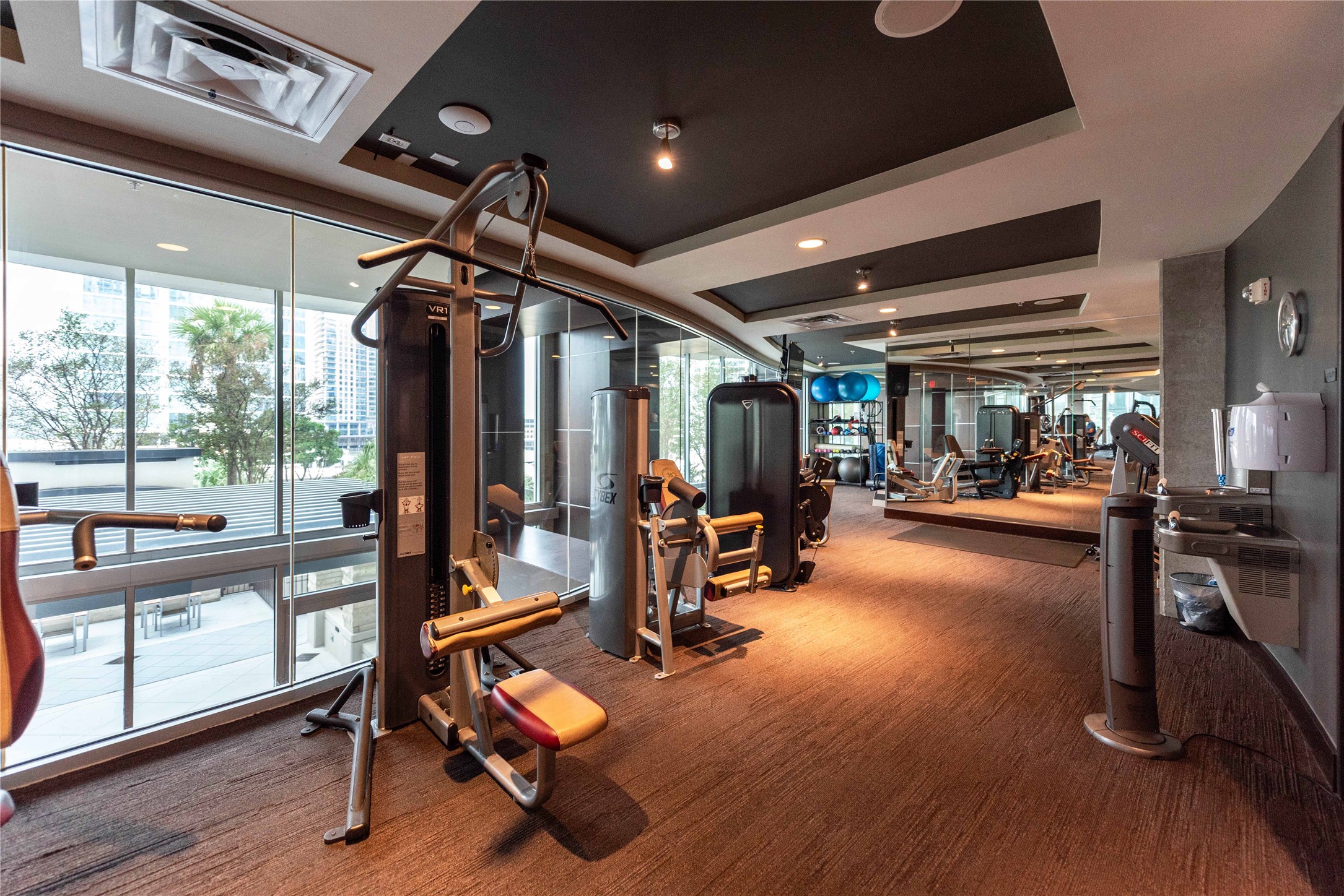 360 Nueces Street, Unit 1214 Austin, TX 78701 - Photo 34 of 38 Community workout area featuring floor to ceiling windows
