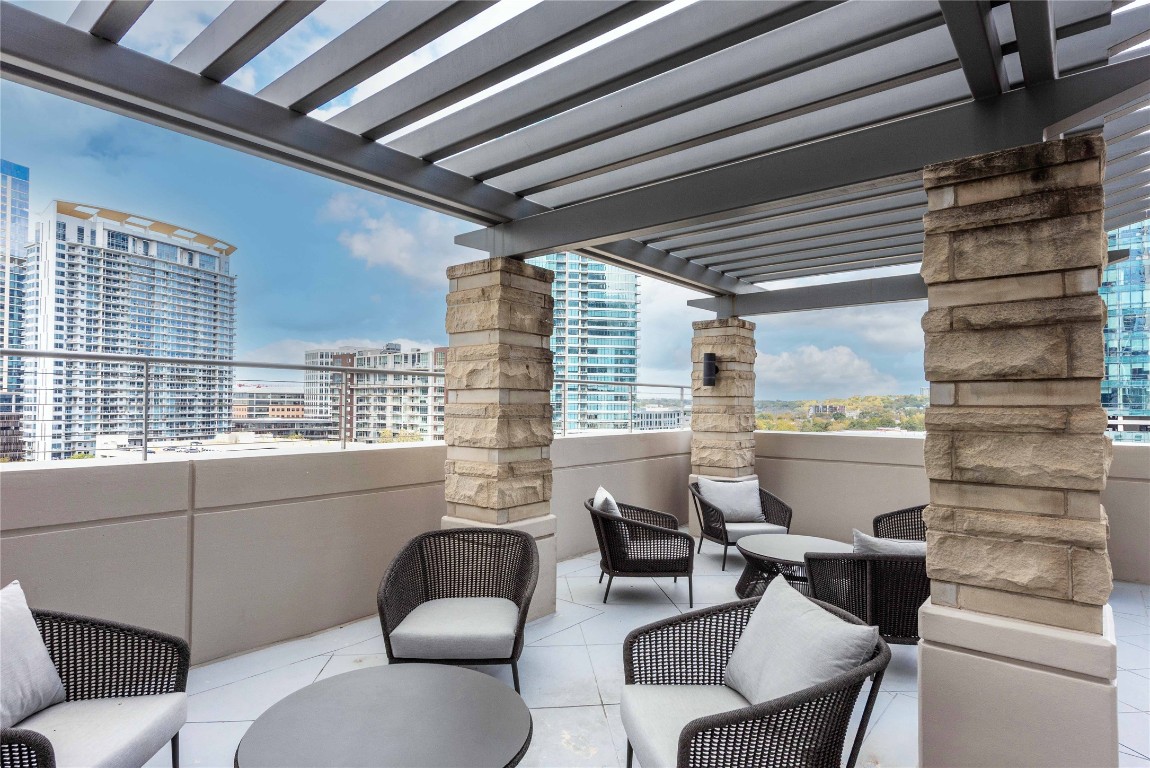 360 Nueces Street, Unit 1214 Austin, TX 78701 - Photo 36 of 38 Community patio / terrace with an outdoor living space, a pergola, and a view of city