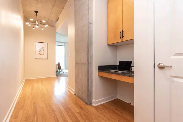a view of kitchen and wooden floor