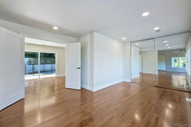 a view of an empty room with windows